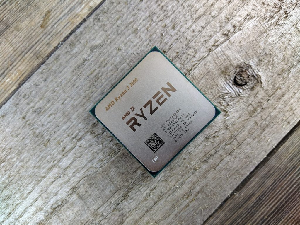 a-close-up-of-a-cpu-on-a-wooden-surface-rmy0zsysauc