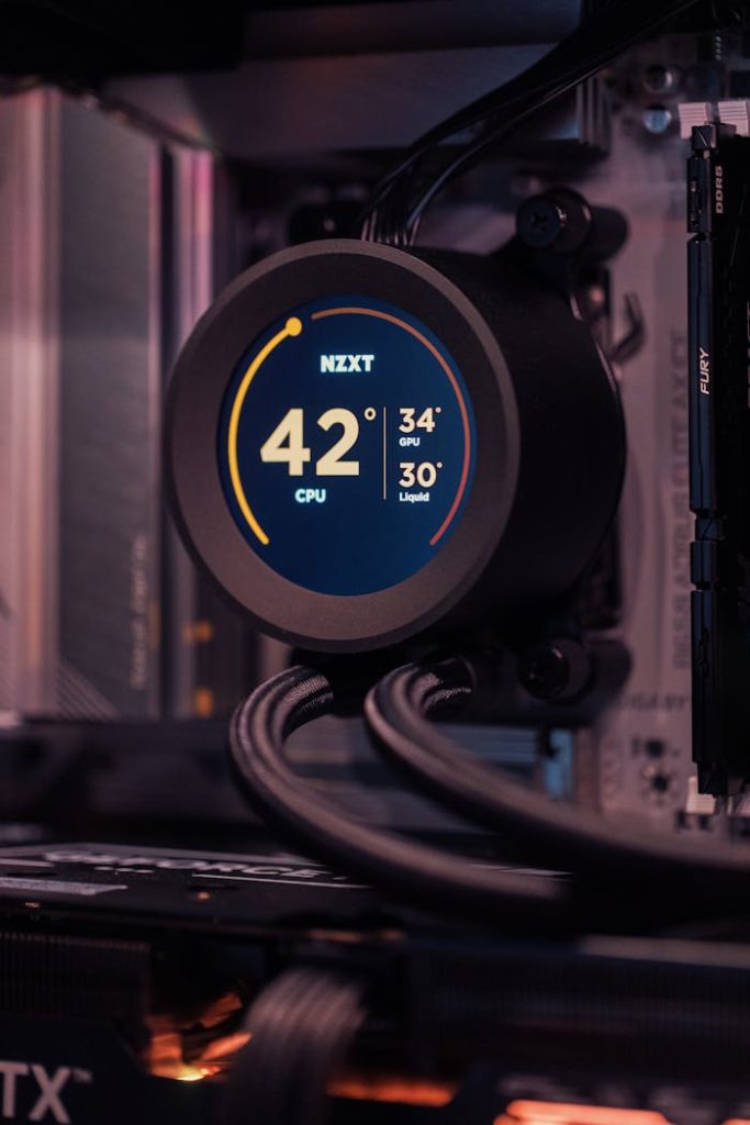 Close-up view of a modern computer cooling system with temperature display.